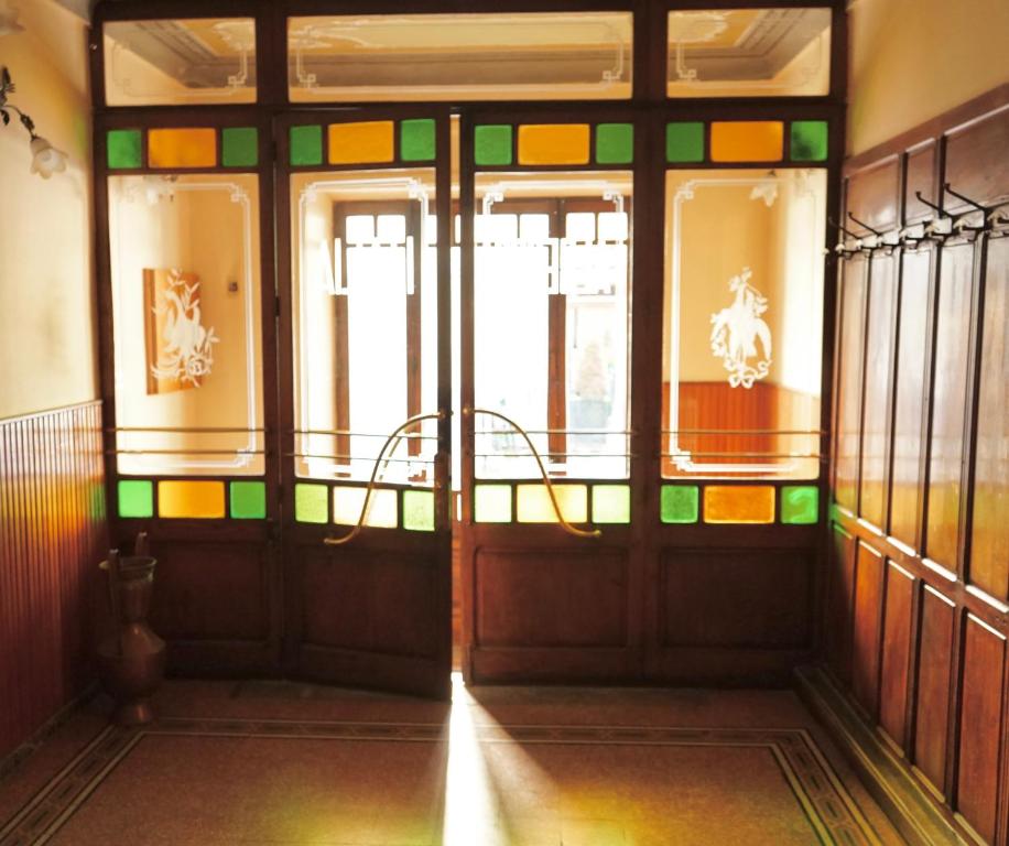 an entrance to a building with stained glass doors at Residenza Italia in Casteldelfino