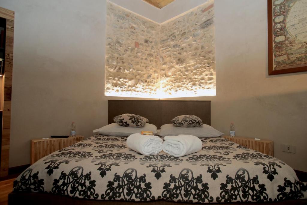 Postel nebo postele na pokoji v ubytování Epicuro guest house