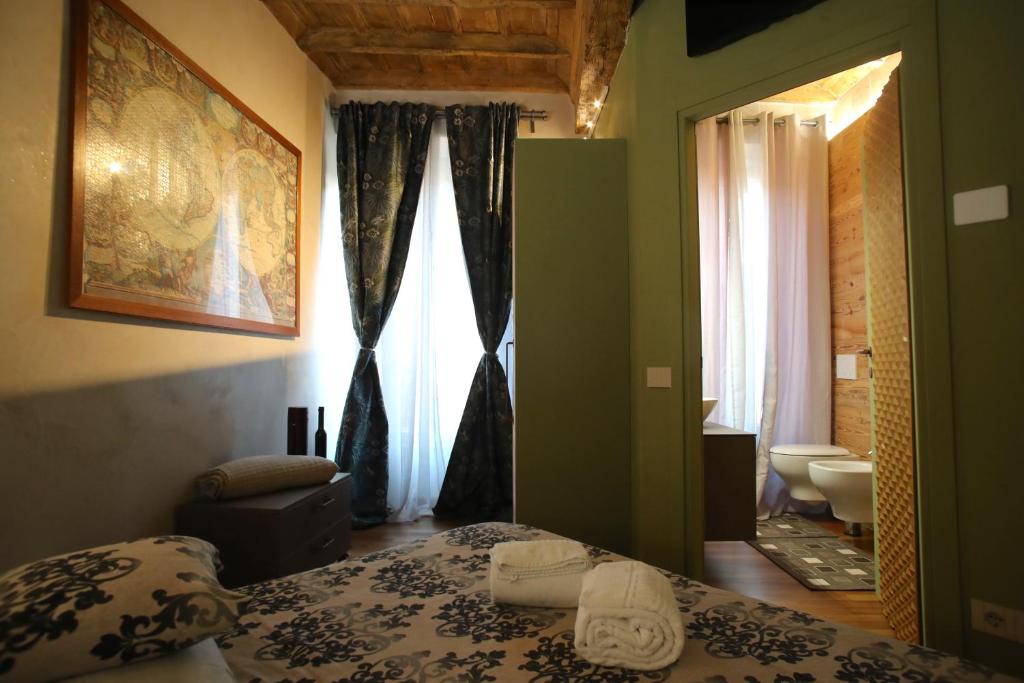 Postel nebo postele na pokoji v ubytování Epicuro guest house