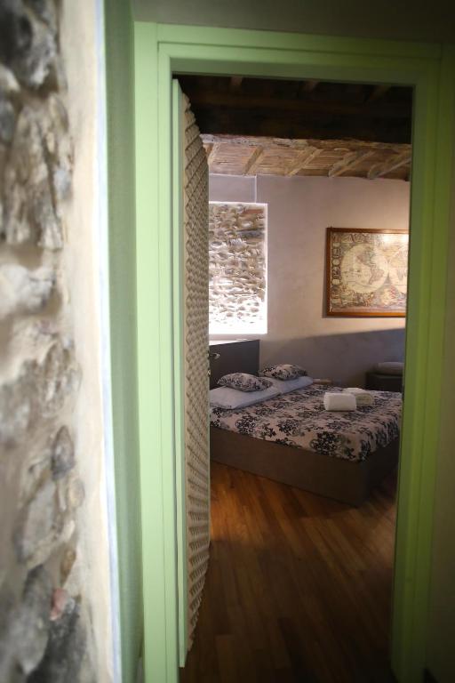 Postel nebo postele na pokoji v ubytování Epicuro guest house