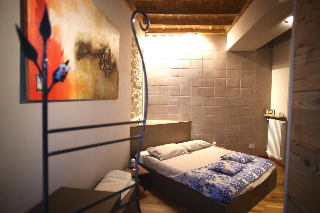 Postel nebo postele na pokoji v ubytování Epicuro guest house