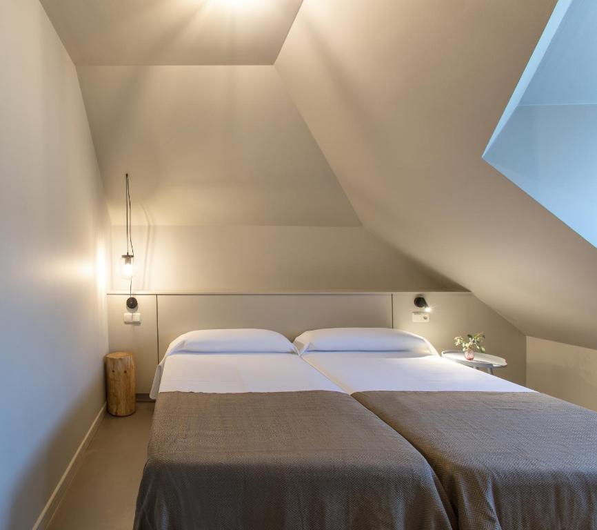Postel nebo postele na pokoji v ubytování Apartamentos Dena