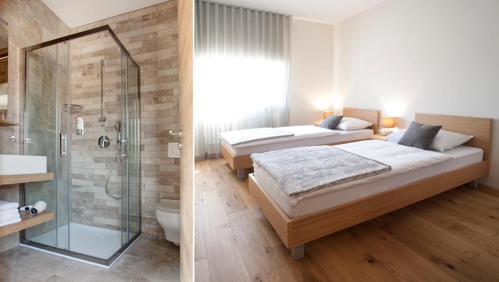 two beds in a room with a shower and a bathroom at Guesthouse Turšič in Vrhnika