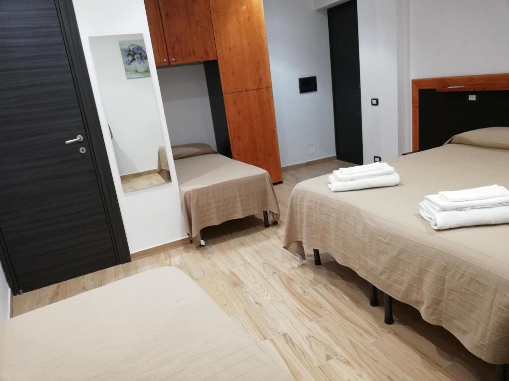 Łóżko lub łóżka w pokoju w obiekcie B&B Controtempo