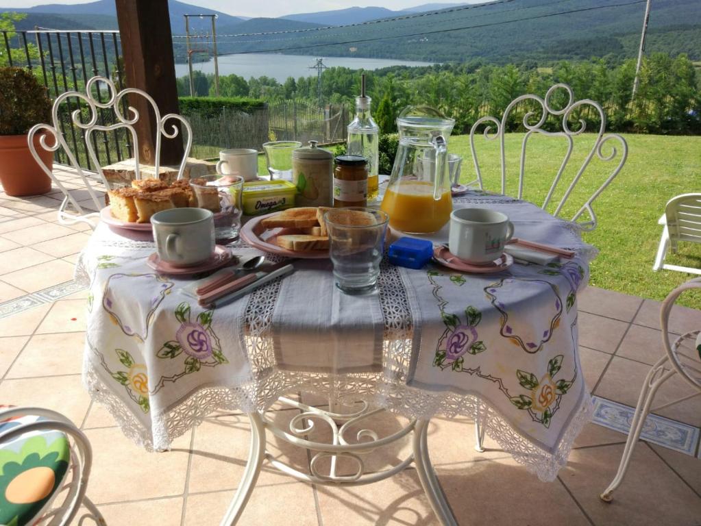 a table with food and a jug of orange juice at El Collado in El Rasillo