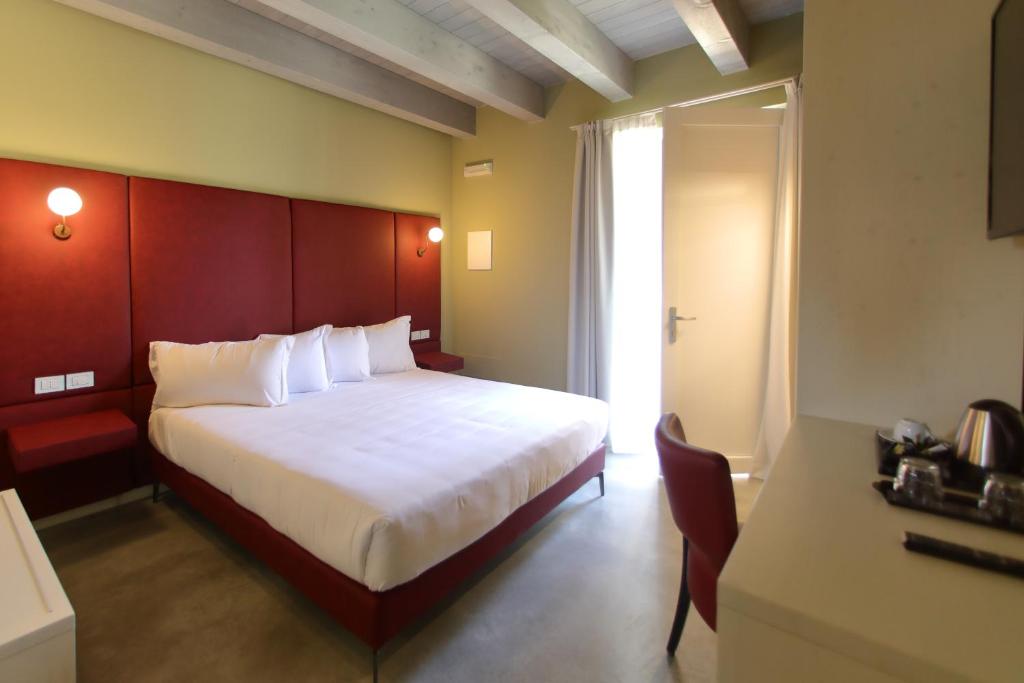 Postel nebo postele na pokoji v ubytování La Boheme Chambres