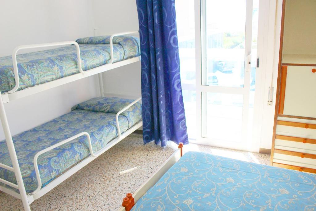 Postel nebo postele na pokoji v ubytování Hotel Laguna