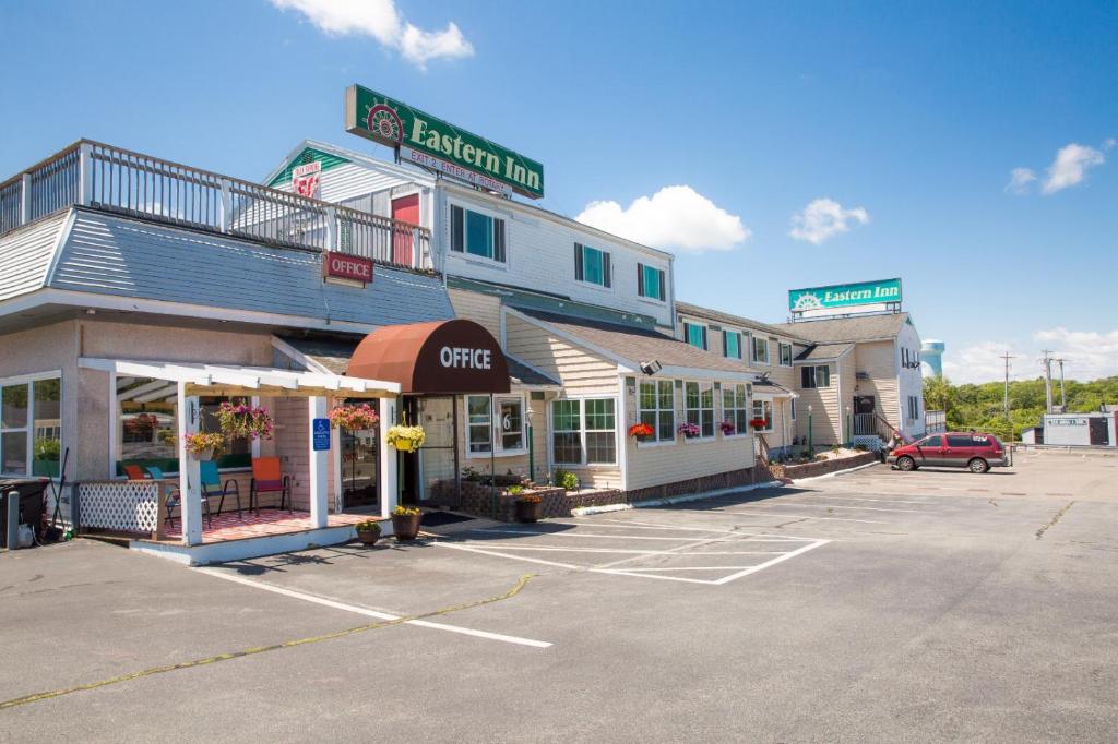 a parking lot in front of a grocery store at Eastern Inn in Bourne