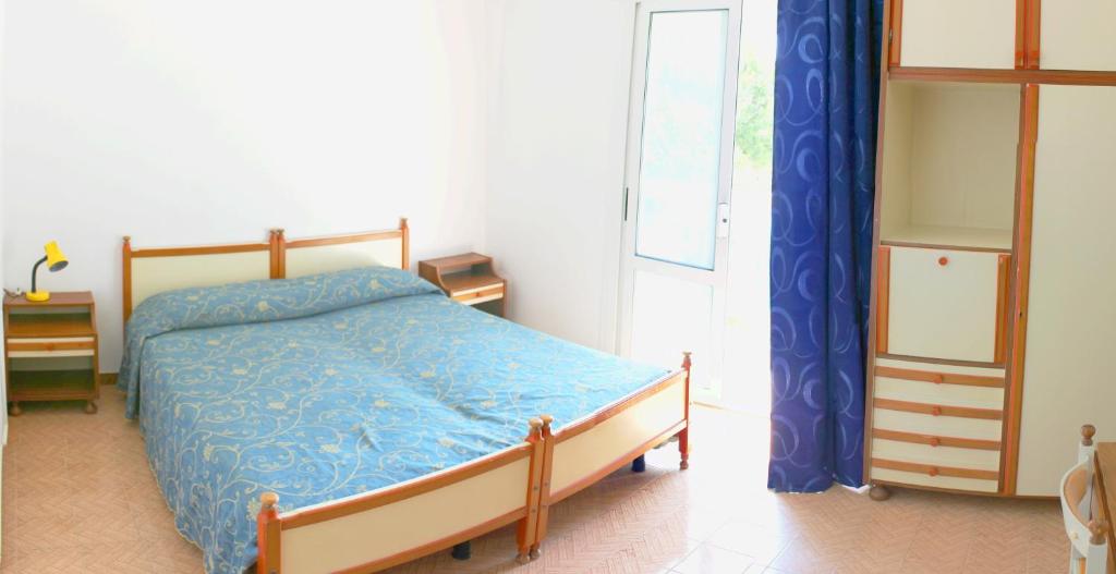 Postel nebo postele na pokoji v ubytování Hotel Laguna