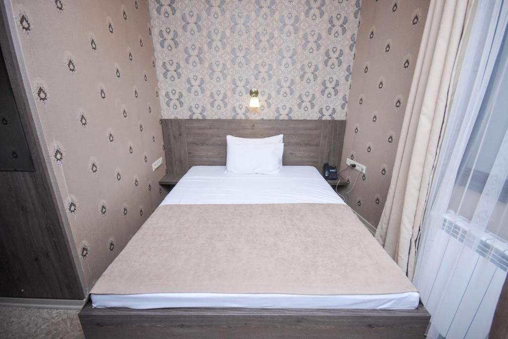 Postel nebo postele na pokoji v ubytování Old Garden Hotel Batumi