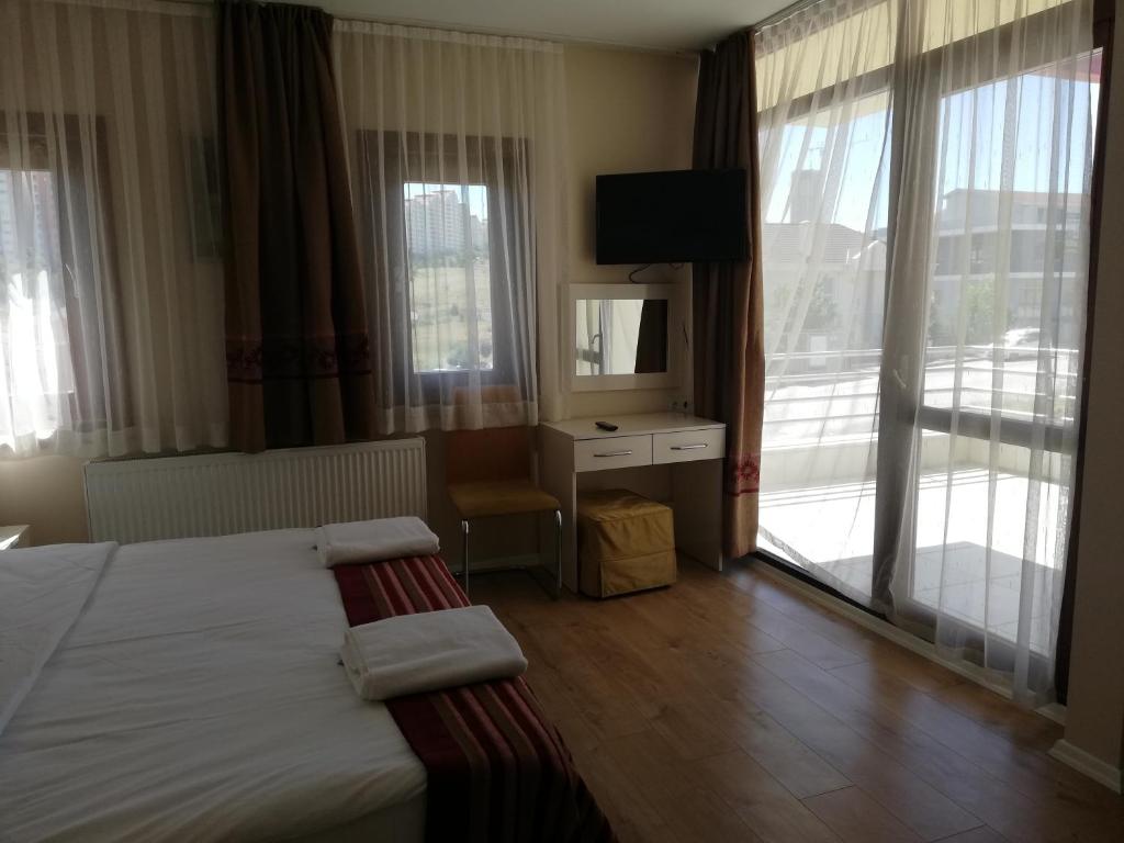 Postel nebo postele na pokoji v ubytování A Apart Hotels Ankara Beytepe