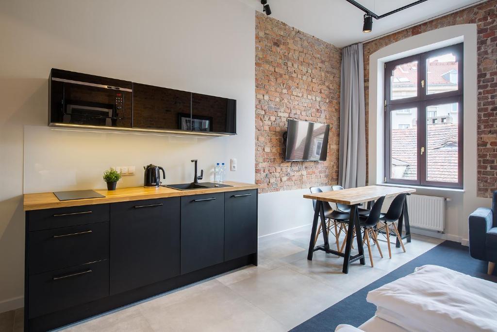 Kuchyňa alebo kuchynka v ubytovaní Loft Apartments Poznań