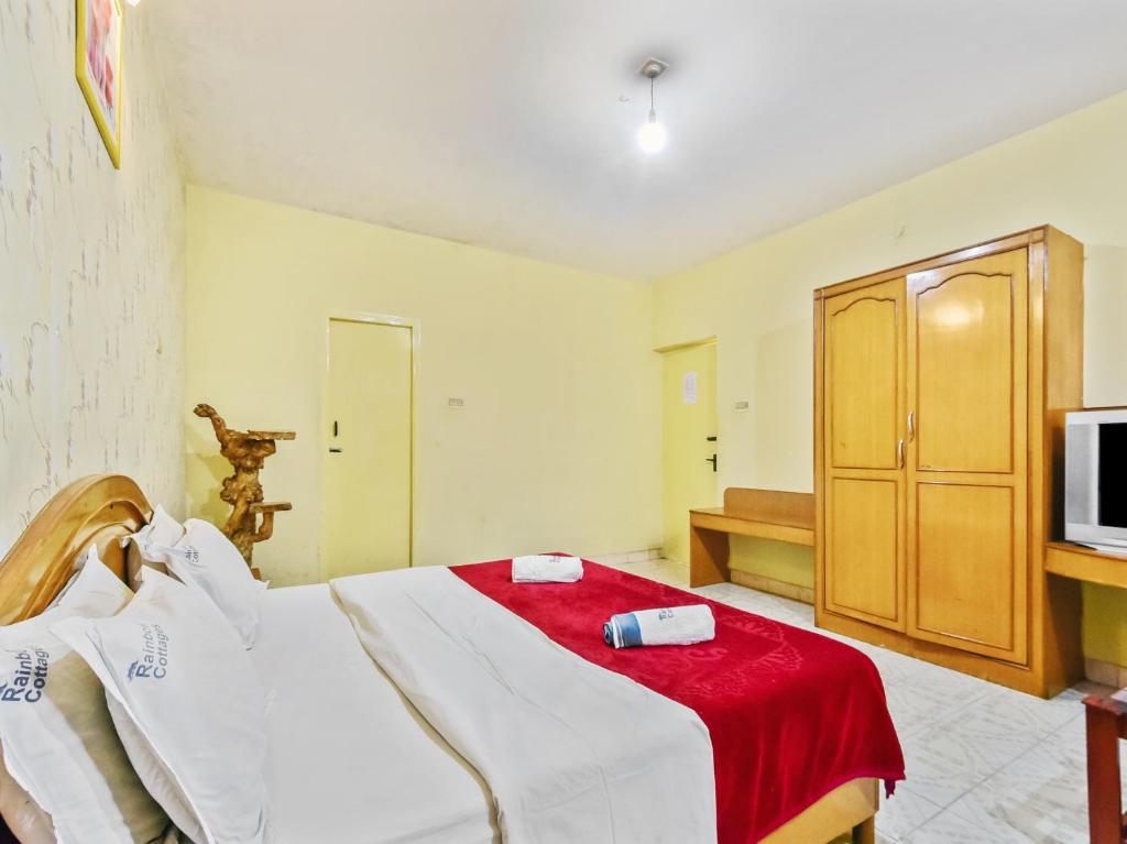 Postel nebo postele na pokoji v ubytování Rainbow Cottages-Budget Friendly rooms