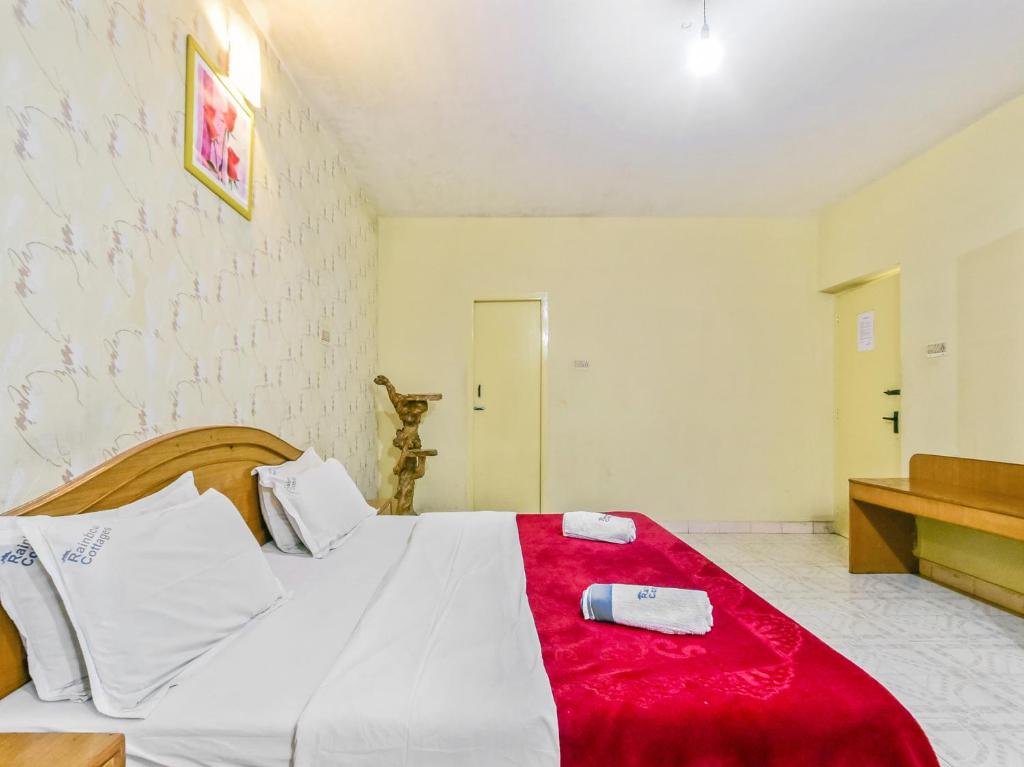 Postel nebo postele na pokoji v ubytování Rainbow Cottages-Budget Friendly rooms