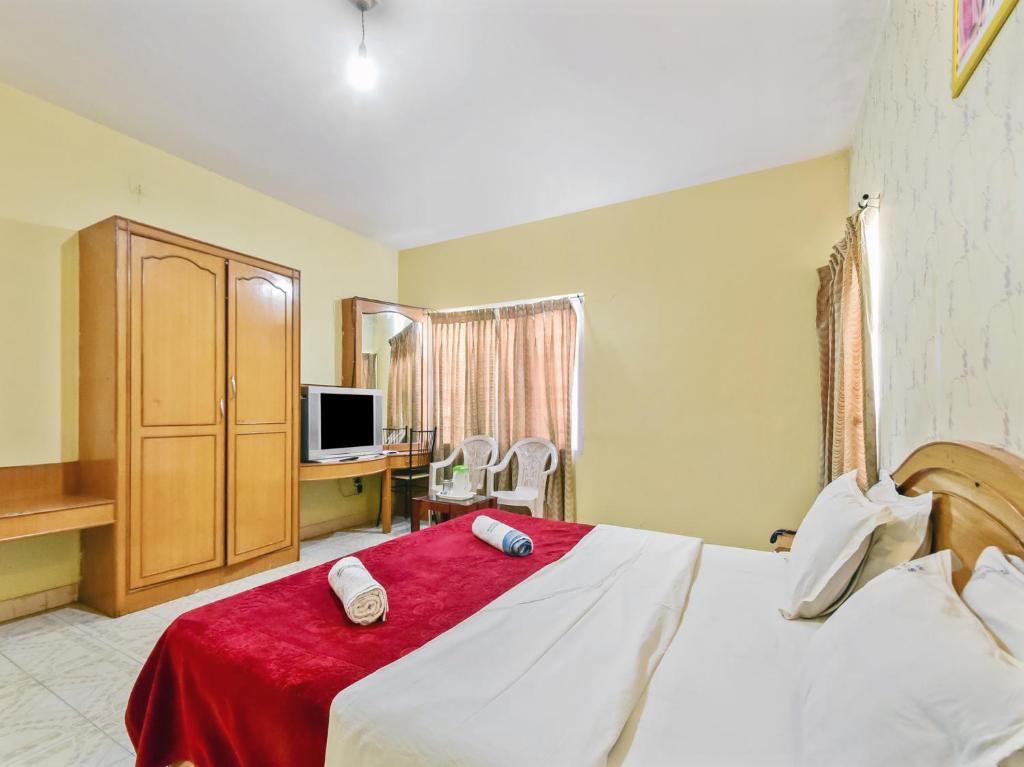 Postel nebo postele na pokoji v ubytování Rainbow Cottages-Budget Friendly rooms