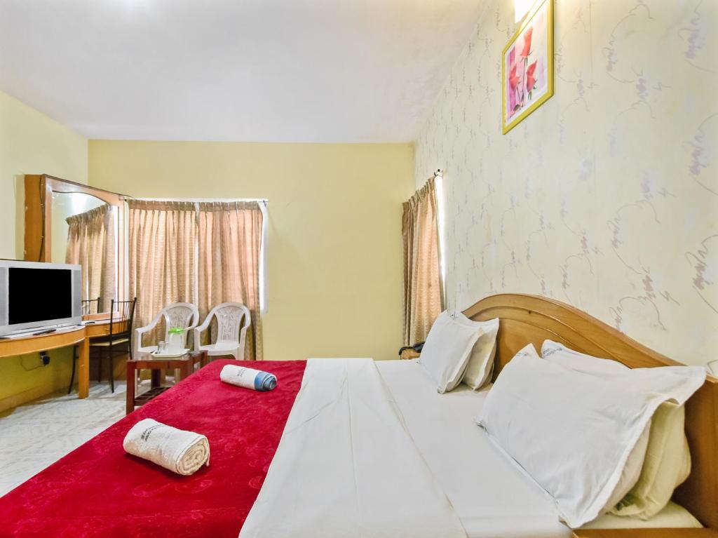 Postel nebo postele na pokoji v ubytování Rainbow Cottages-Budget Friendly rooms