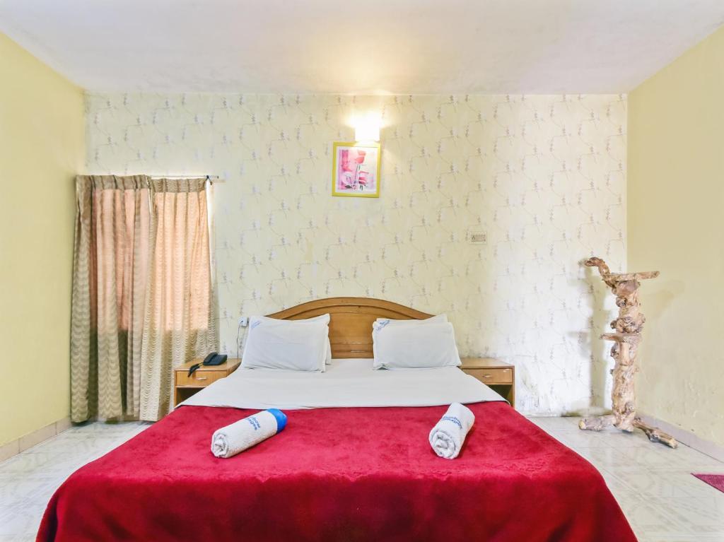 Postel nebo postele na pokoji v ubytování Rainbow Cottages-Budget Friendly rooms