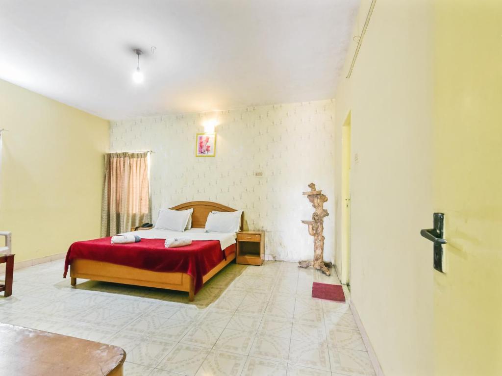 Postel nebo postele na pokoji v ubytování Rainbow Cottages-Budget Friendly rooms