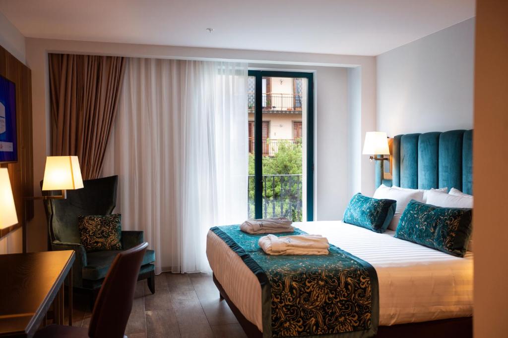 Ένα ή περισσότερα κρεβάτια σε δωμάτιο στο Elke Spa Hotel
