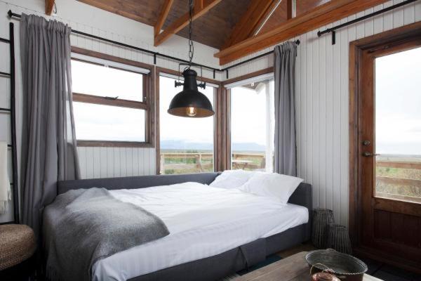Postel nebo postele na pokoji v ubytování Mulakot Cosy Cabins