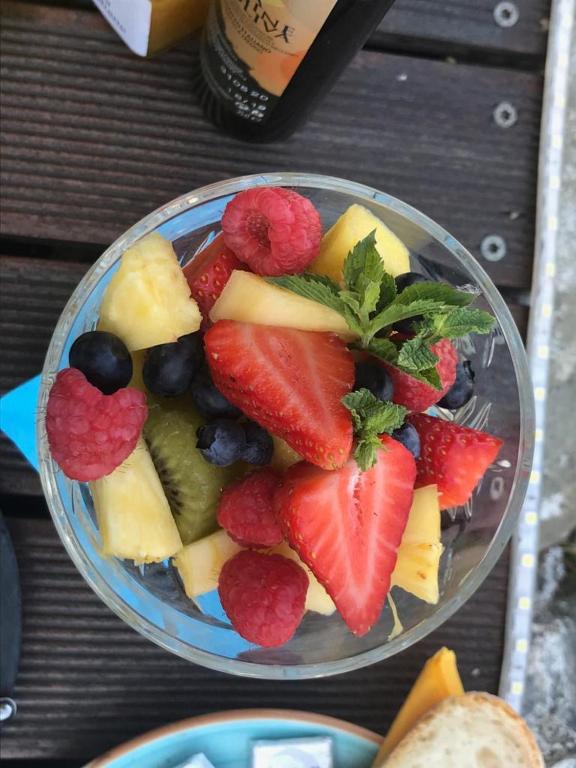 a bowl of fruit on a wooden table at il Magàn - Cinque Terre in Corniglia