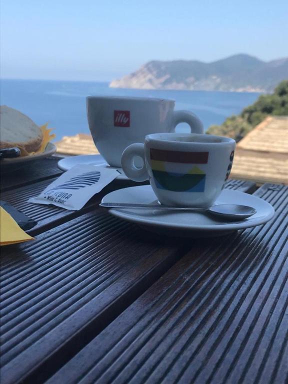 a coffee cup sitting on top of a table at il Magàn - Cinque Terre in Corniglia