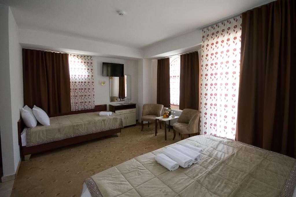 Postel nebo postele na pokoji v ubytování Hotel Nar Gevgelija
