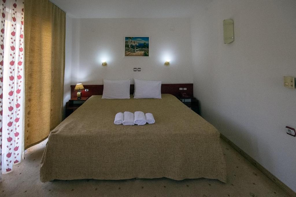 Postel nebo postele na pokoji v ubytování Hotel Nar Gevgelija