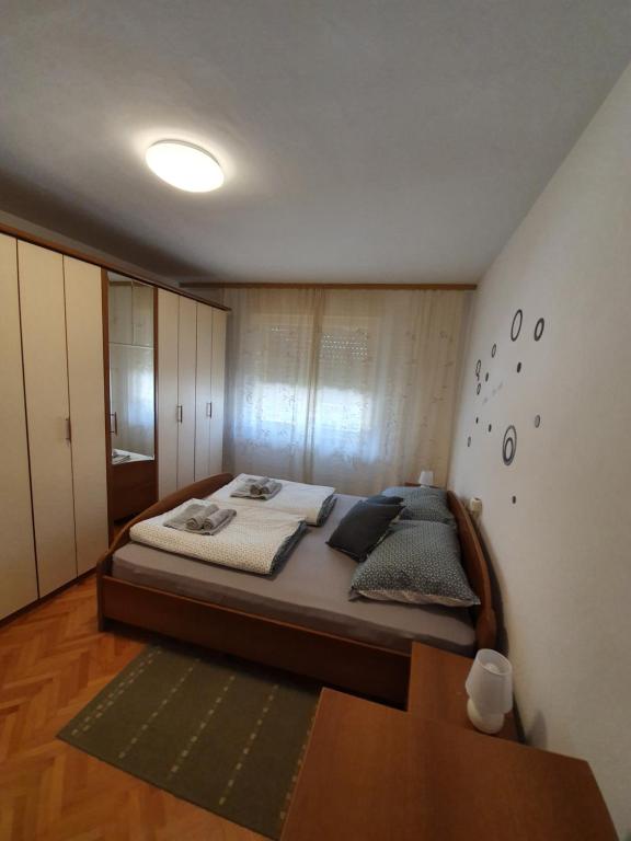 Posteľ alebo postele v izbe v ubytovaní Apartman Val