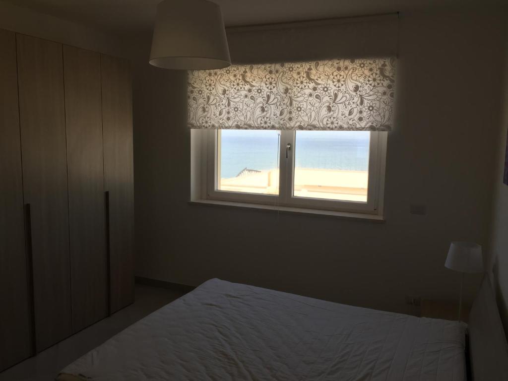 Postel nebo postele na pokoji v ubytování Appartamenti Stella Del Mare