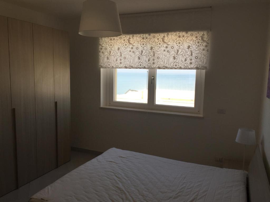 Postel nebo postele na pokoji v ubytování Appartamenti Stella Del Mare