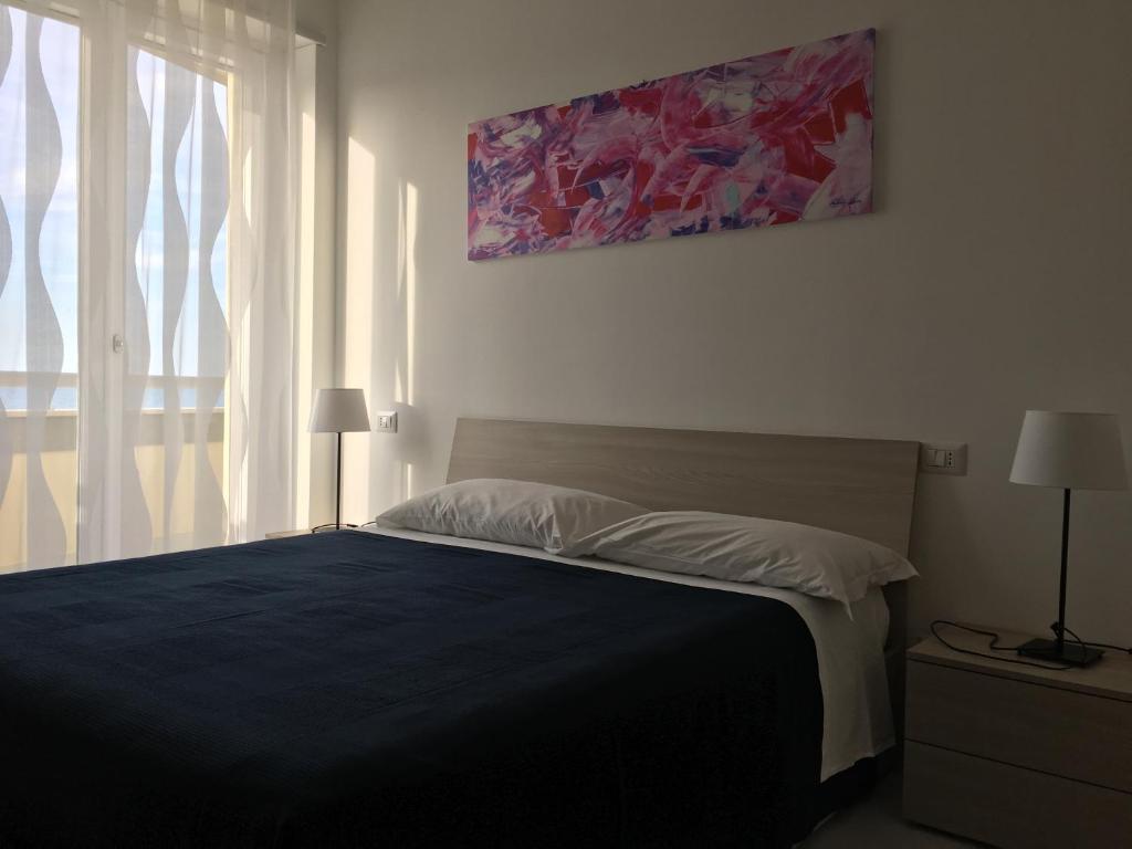 Postel nebo postele na pokoji v ubytování Appartamenti Stella Del Mare