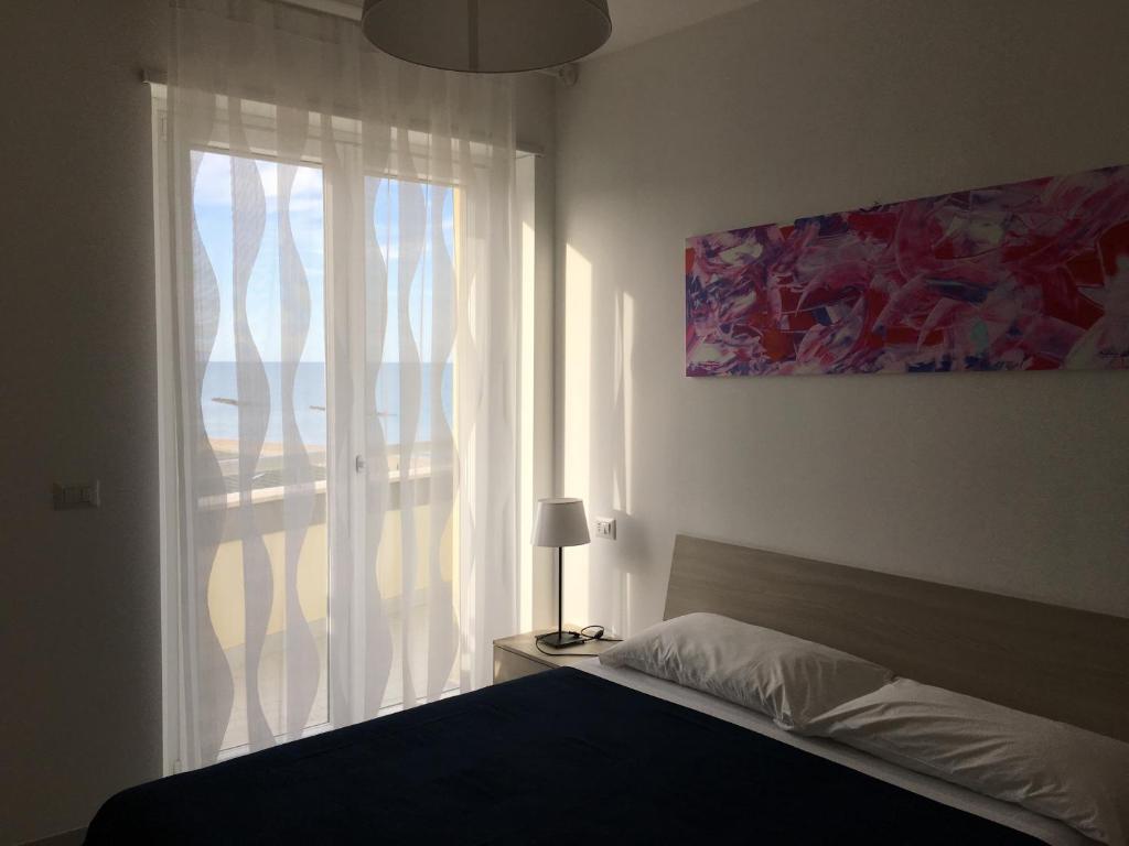 Postel nebo postele na pokoji v ubytování Appartamenti Stella Del Mare