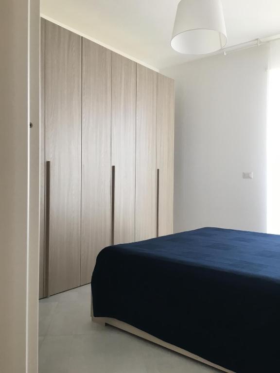 Postel nebo postele na pokoji v ubytování Appartamenti Stella Del Mare