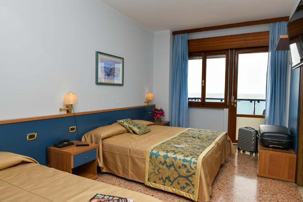 Postel nebo postele na pokoji v ubytování Hotel Souvenir