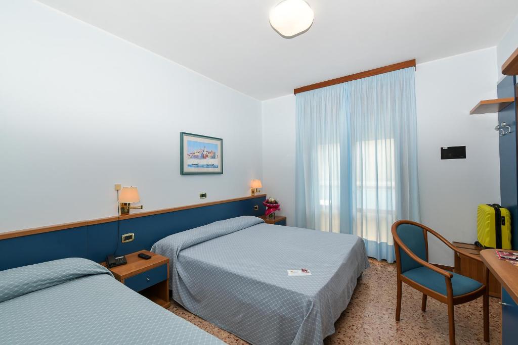 Postel nebo postele na pokoji v ubytování Hotel Souvenir