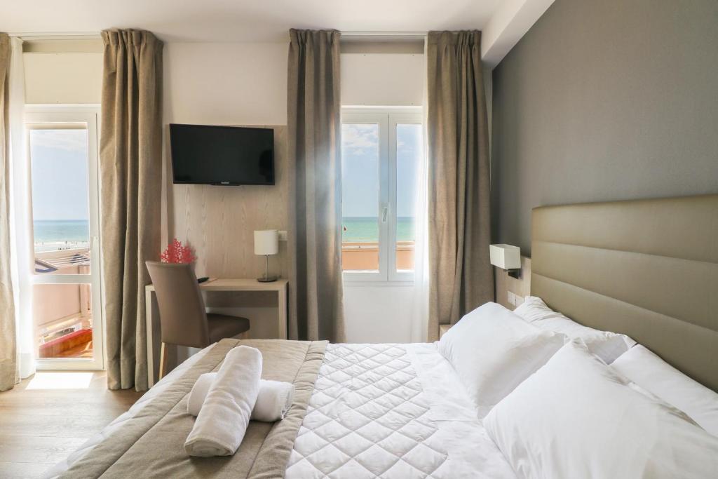 Postel nebo postele na pokoji v ubytování Hotel Loreley
