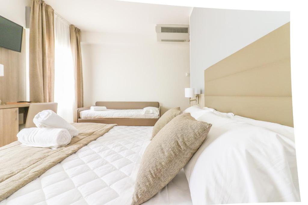 Postel nebo postele na pokoji v ubytování Hotel Loreley