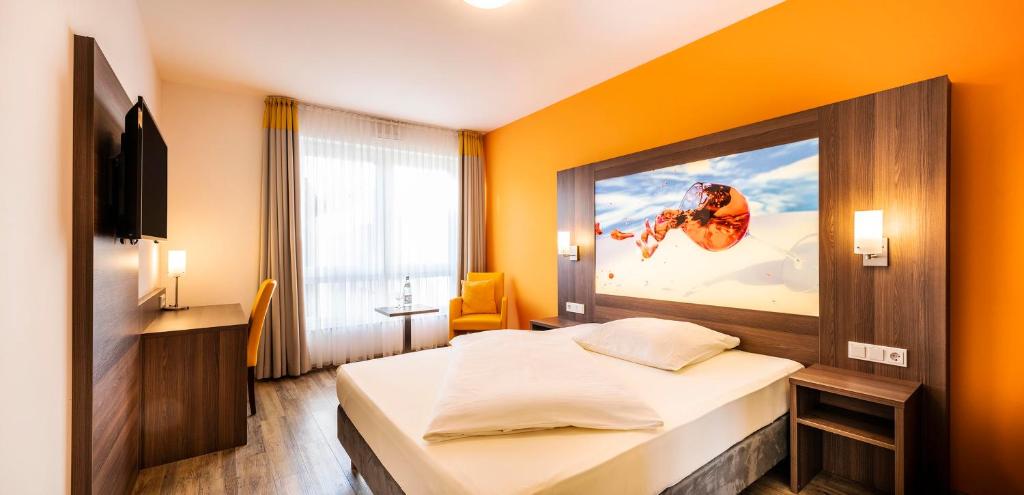 Postel nebo postele na pokoji v ubytování Schroeders Wein-Style-Hotel
