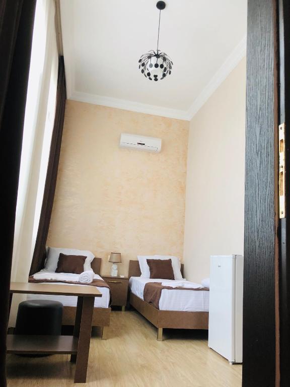Postel nebo postele na pokoji v ubytování Guesthouse Family