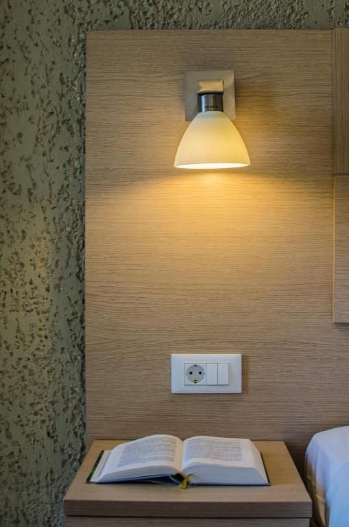 Postel nebo postele na pokoji v ubytování Hotel Alkionis