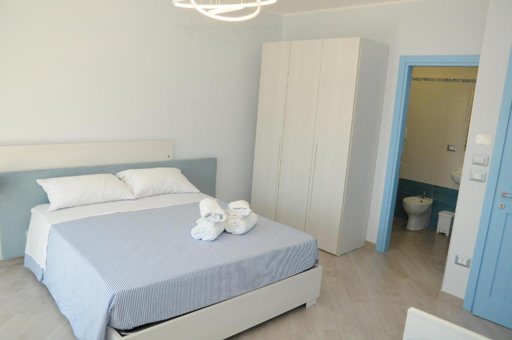 Postel nebo postele na pokoji v ubytování Tamarix