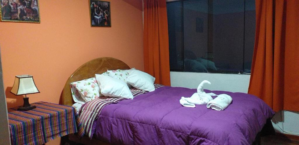 Postel nebo postele na pokoji v ubytování Kaboka Cusco Hospedaje Familiar