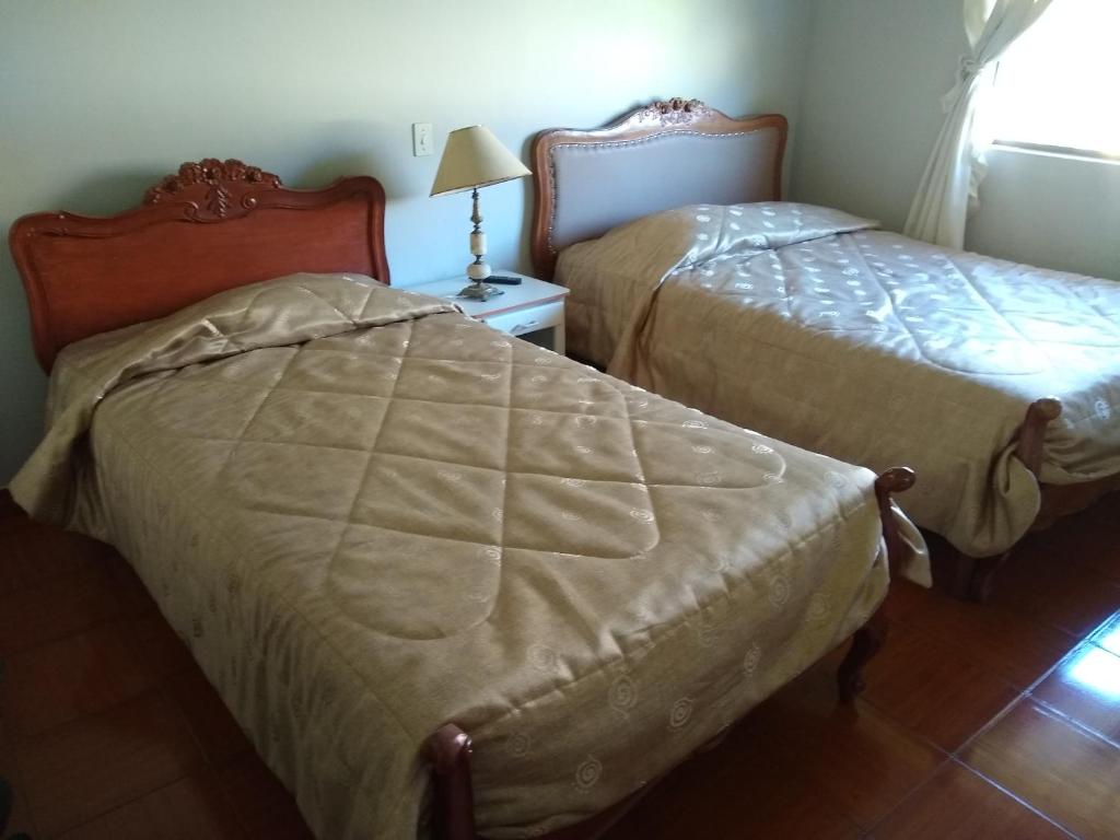 Postel nebo postele na pokoji v ubytování Hotel COMTUCAR