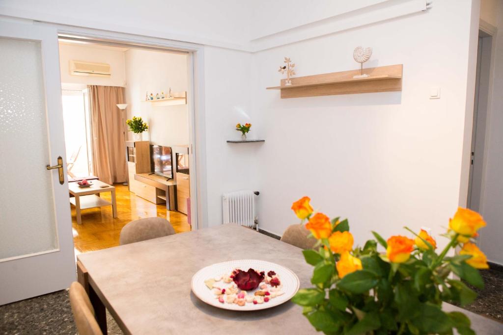a dining room with a table with a plate of food on it at Acropolis,Historic center Apartment-update in Athens