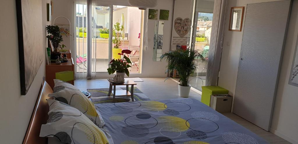 Ένα ή περισσότερα κρεβάτια σε δωμάτιο στο Chambres d'hôtes Chez Pat et Nanou
