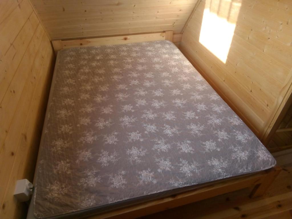 Postel nebo postele na pokoji v ubytování Nowe Domki Pod Lipami