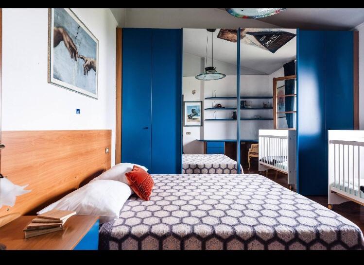 Ένα ή περισσότερα κρεβάτια σε δωμάτιο στο Casa L'Ulivo