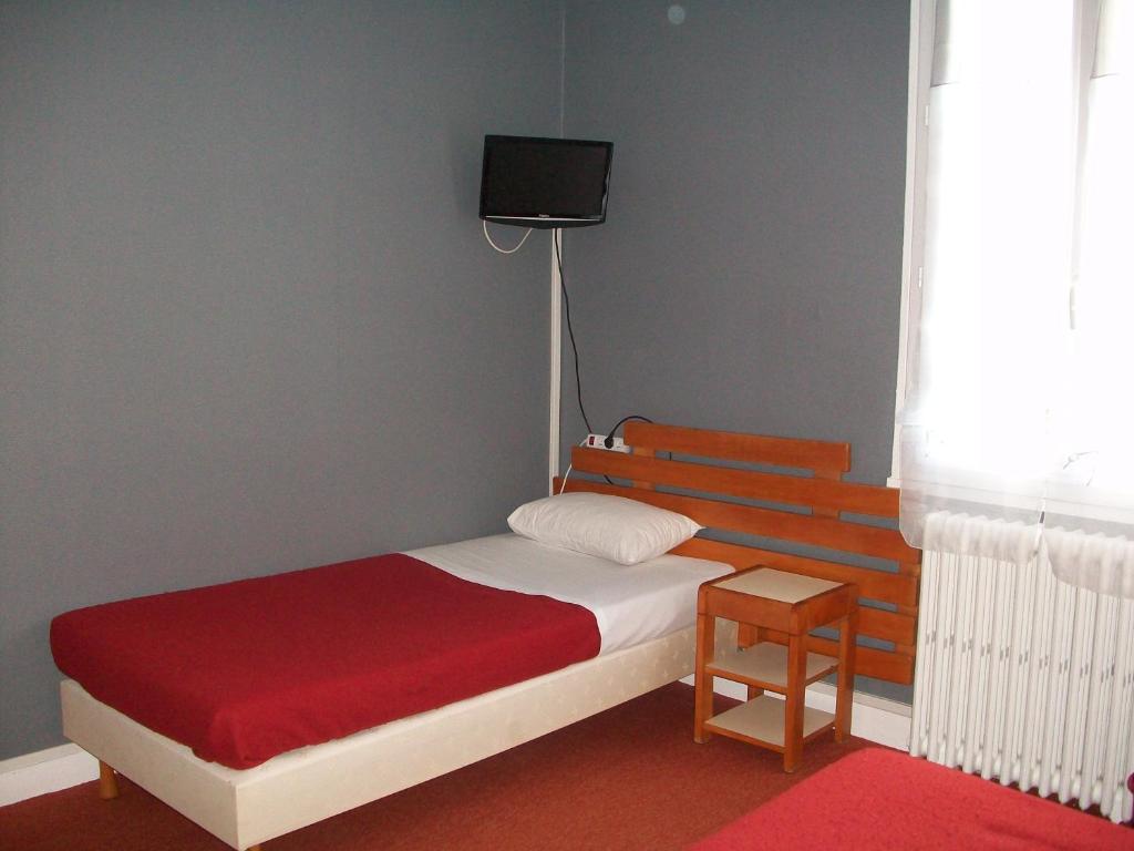 Postel nebo postele na pokoji v ubytování Hotel L'Aiglon