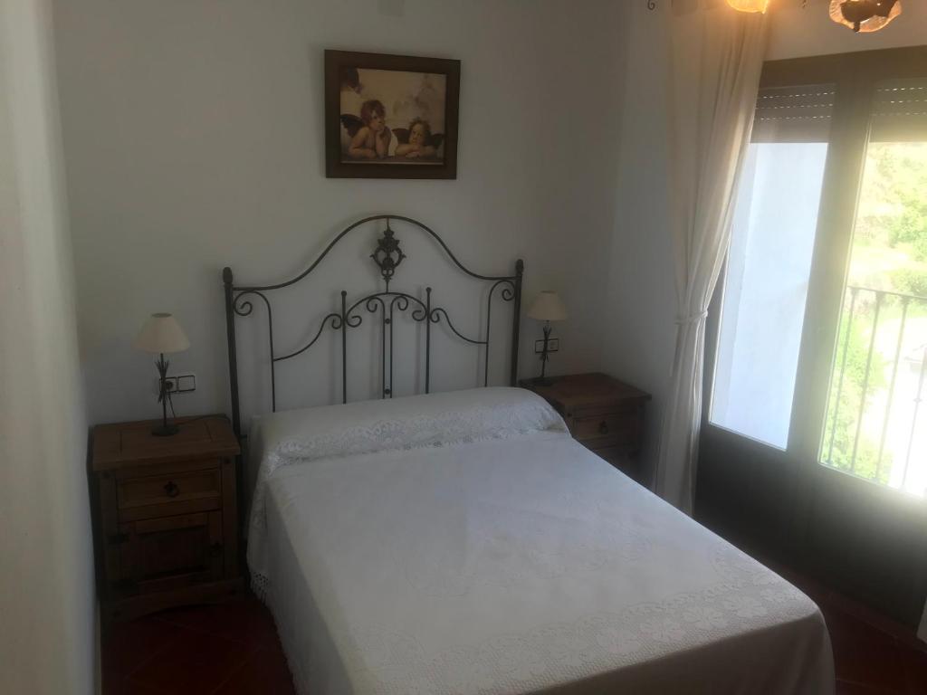 Postelja oz. postelje v sobi nastanitve Alojamiento Rural '' Los Ciruelillos''